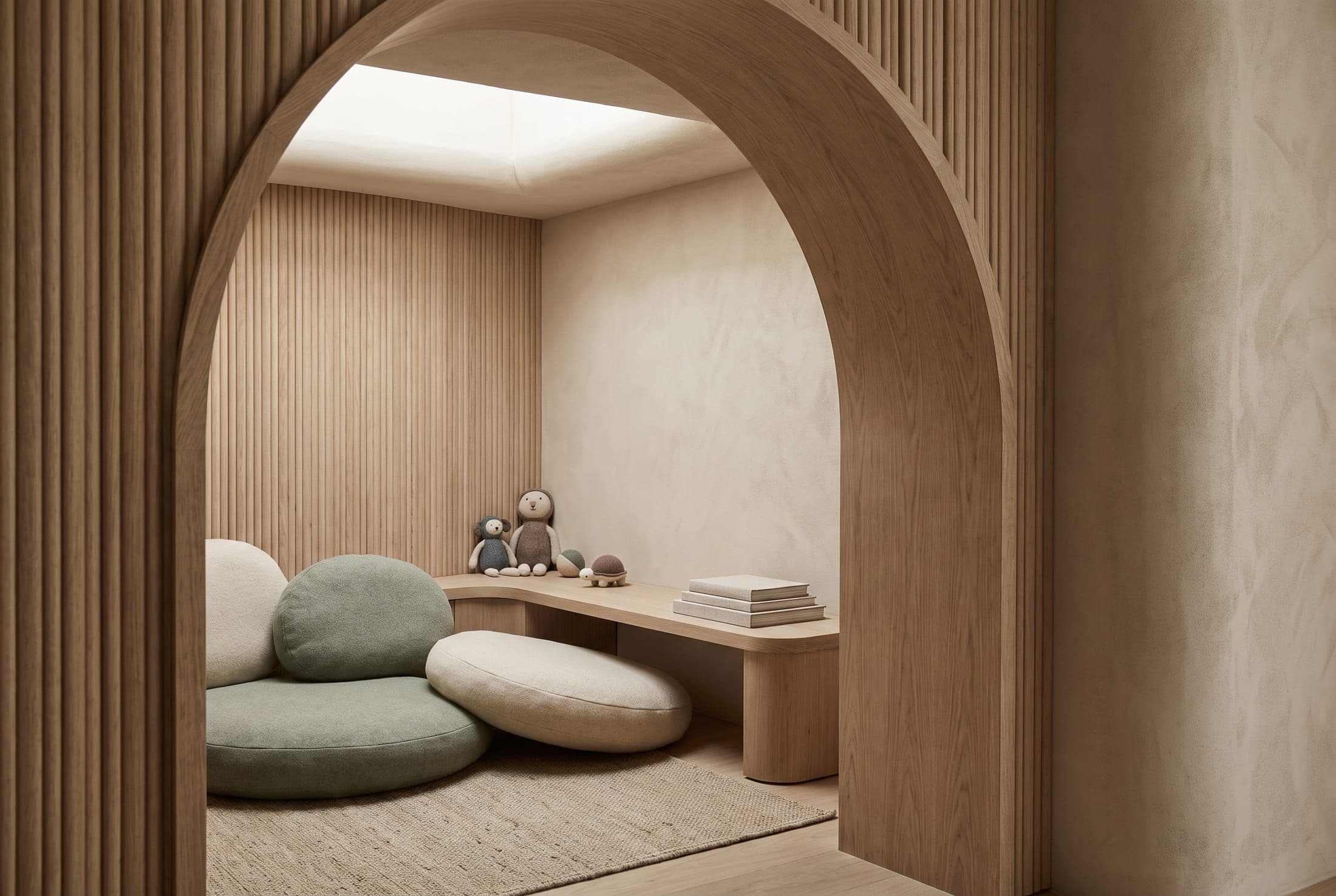 A softly lit wooden archway opening onto an enclosed sensory retreat nook with sage-green cushions
